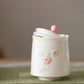 桜・気品高い 茶筒 茶入 お茶缶 花柄 小鉢 小サイズ かわいい 小 茶の箱 蓋付 キャニスター 収納ジャー コーヒー豆 コーヒーキャニスター 珈琲キャニスター 蓋物 棗 珍味入れ 一輪挿し 蓋つき小鉢 蓋物 緑茶 茶葉 保存容器 豆入れ 防湿保存 磁器 IwaiLoft